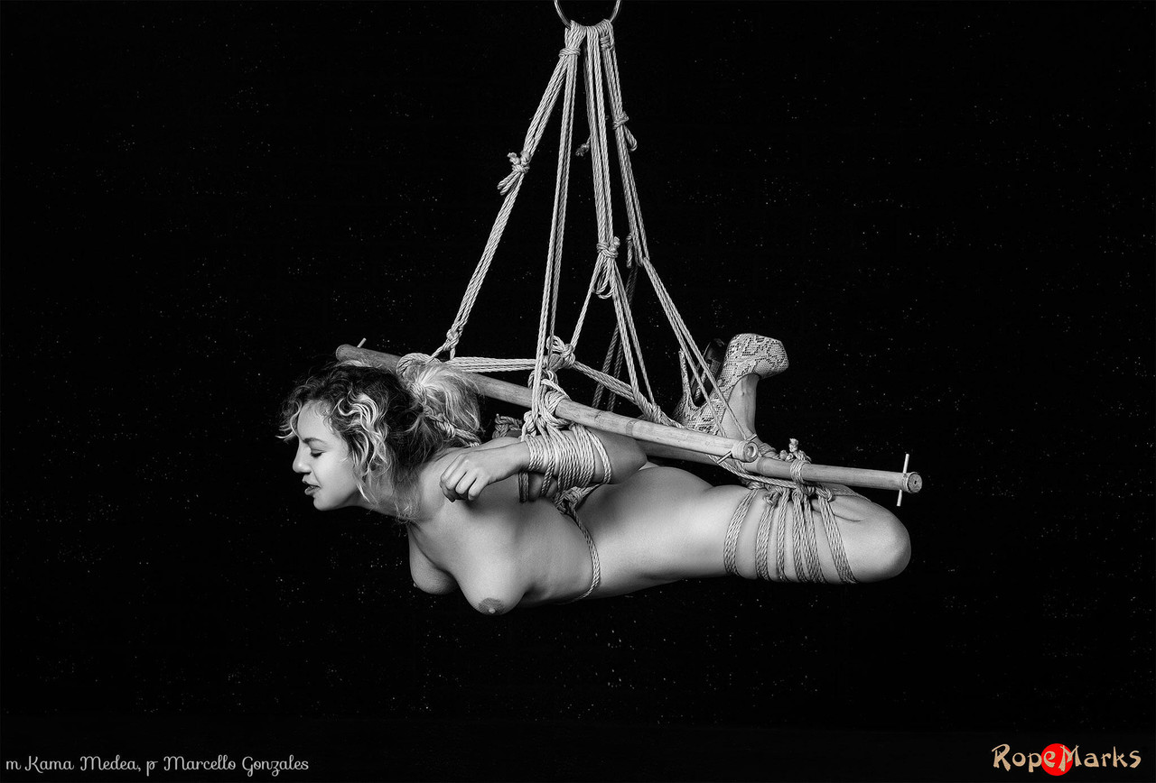 naked white girl kama medea is suspended by ropes while anally hooked