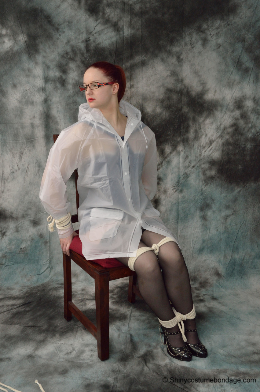 redheaded chick in a raincoat and glasses gets tied up and gagged