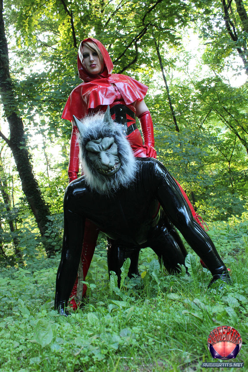 cosplay enthusiasts don latex little red riding hood and big bad wolf costumes