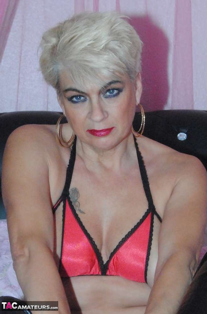 platinum blonde dimonty rubs her twat in a revealing bikini top and long boots