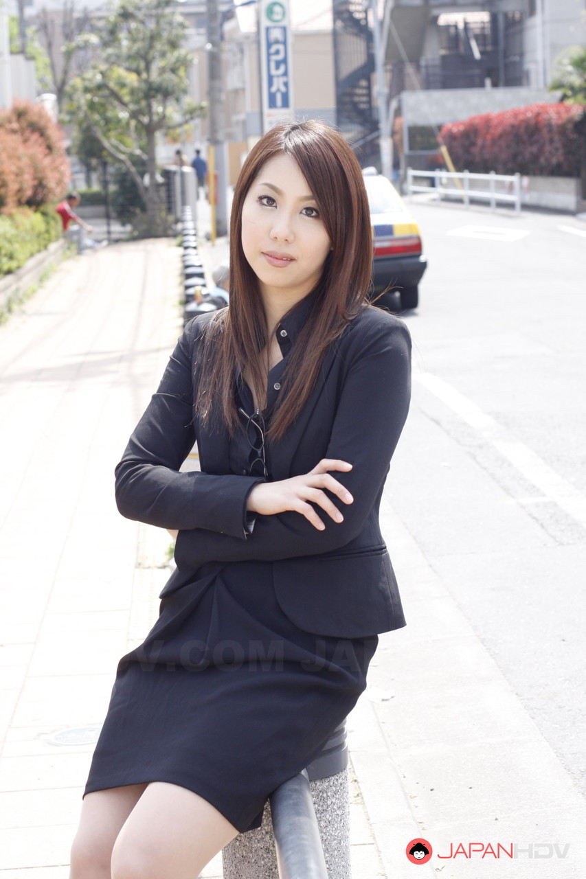japanese model hikaru matsu takes her glasses on and off in business clothing