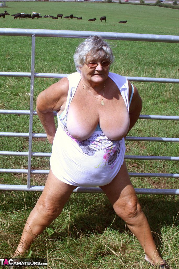 old british woman grandma libby exposes herself next to a field of cattle