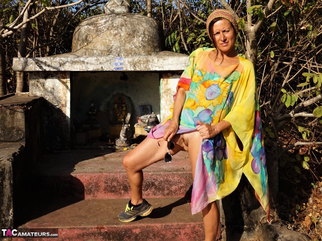 older lady diana ananta exposes herself during a hike to a shrine atop a cliff