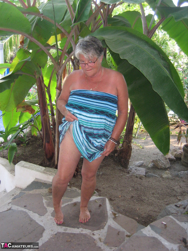 old woman girdle goddess smokes before exposing her fat body on her patio
