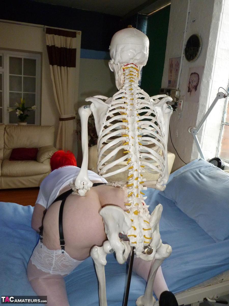 older redhead nurse valgasmic exposed gets banged by a dildo wielding skeleton