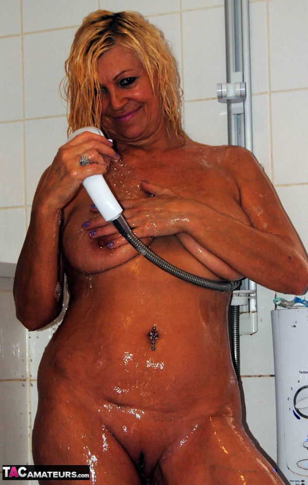 sexy older woman platinum blonde gets caught totally naked while in the shower
