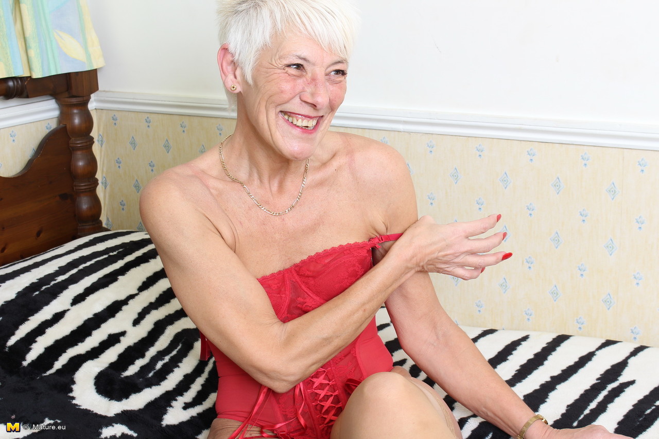 over 70 bristish granny takes off her clothes and lingerie striptease style